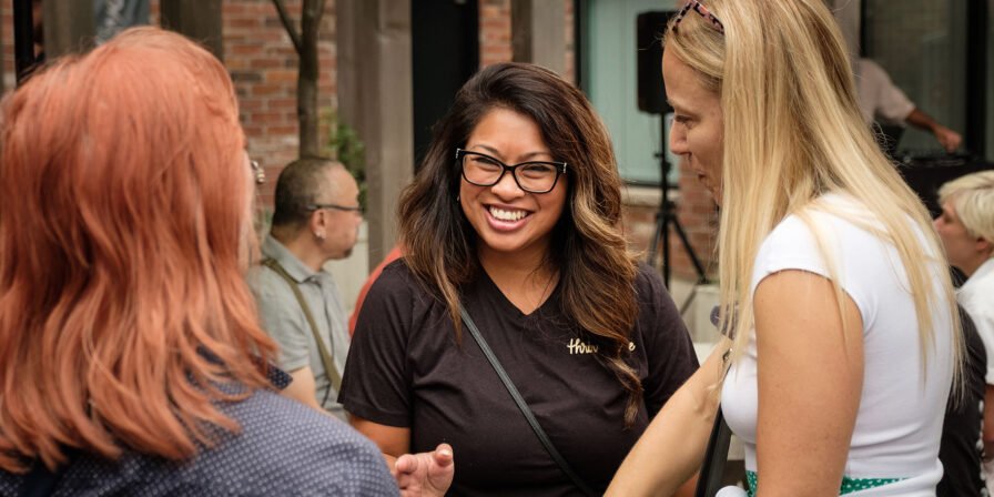 People conversing and enjoying at a Cafe during an event.